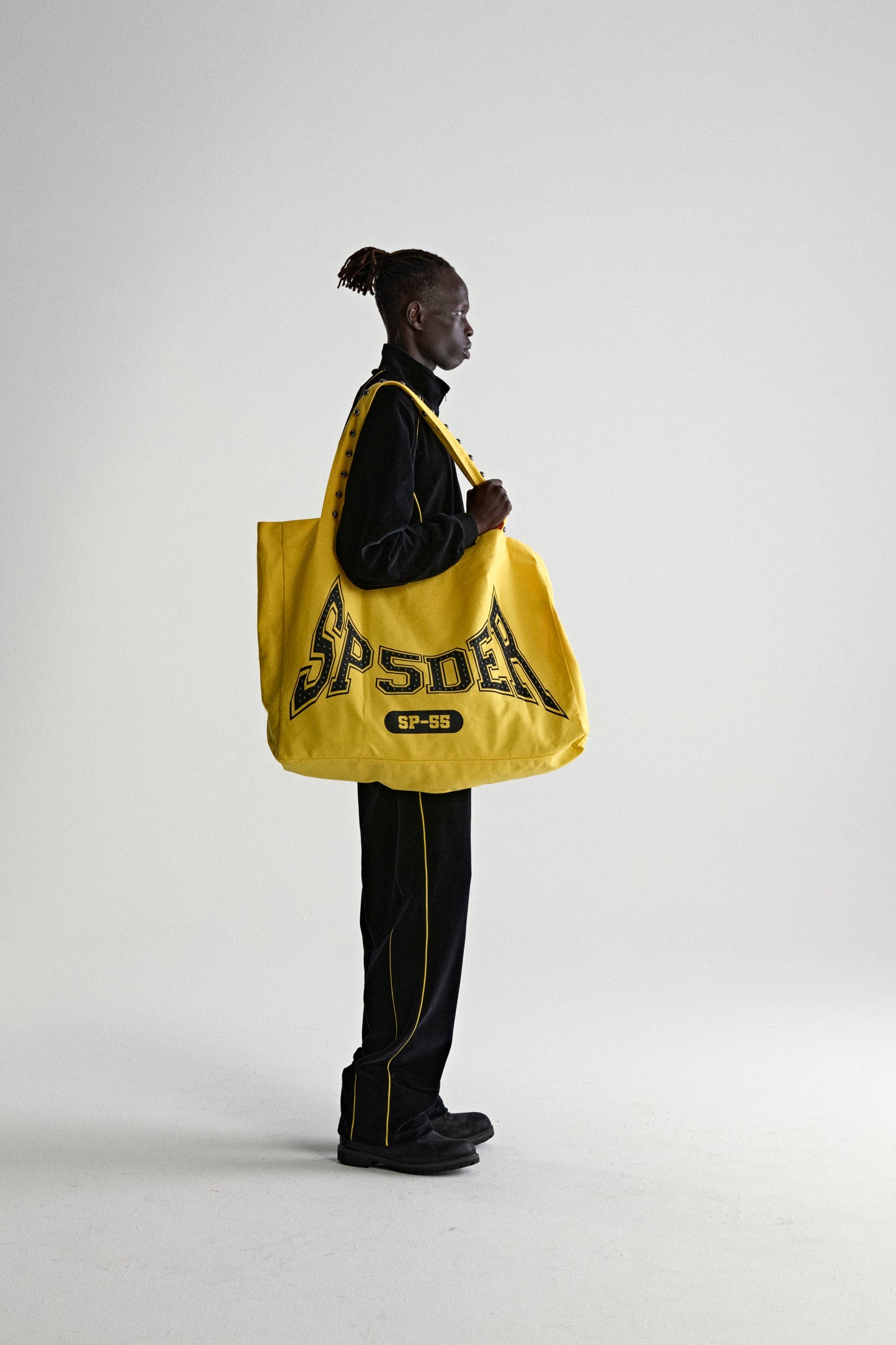 YELLOW T&F STUDDED TOTE ON MODEL