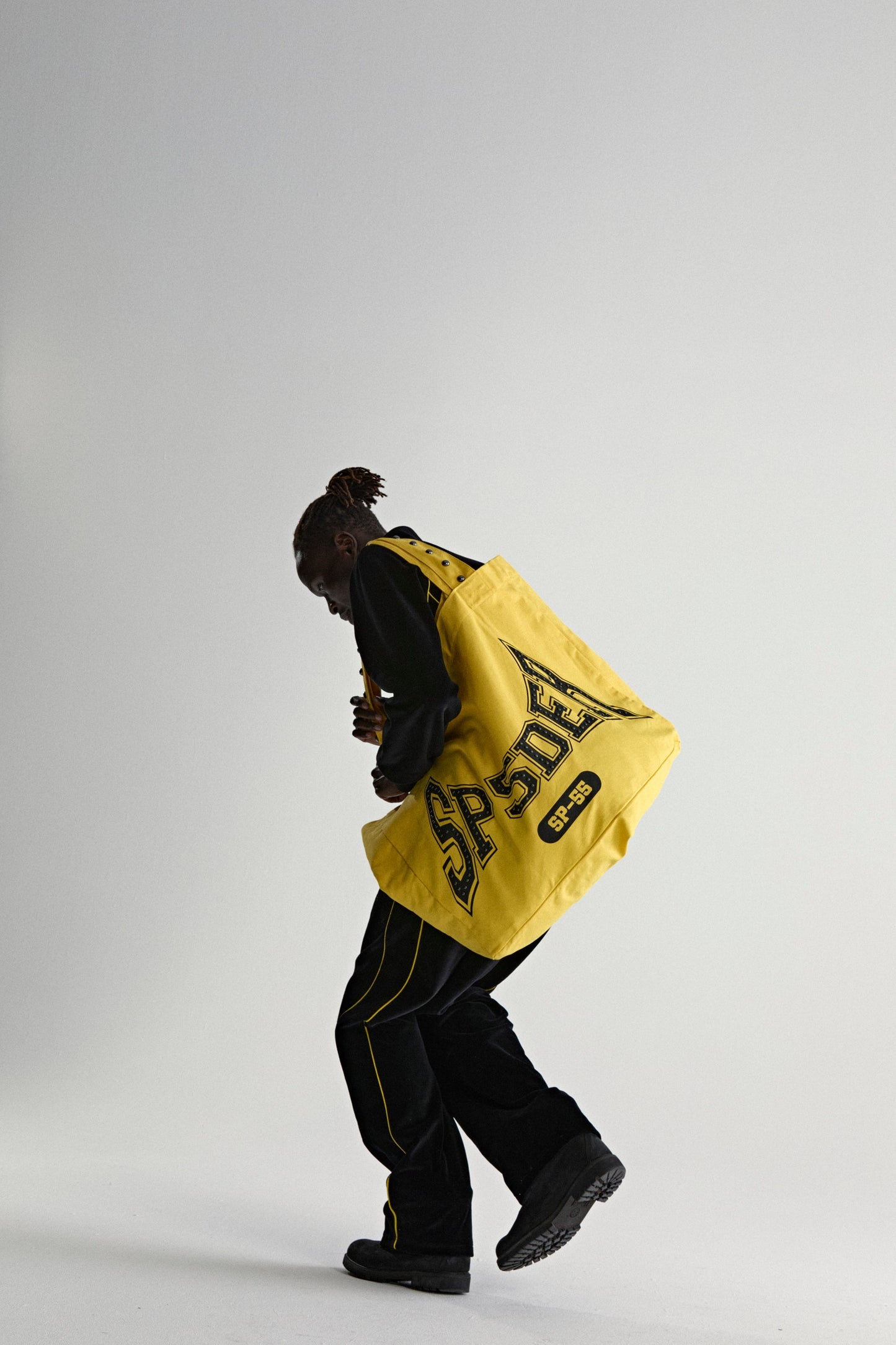 YELLOW T&F STUDDED TOTE ON MODEL