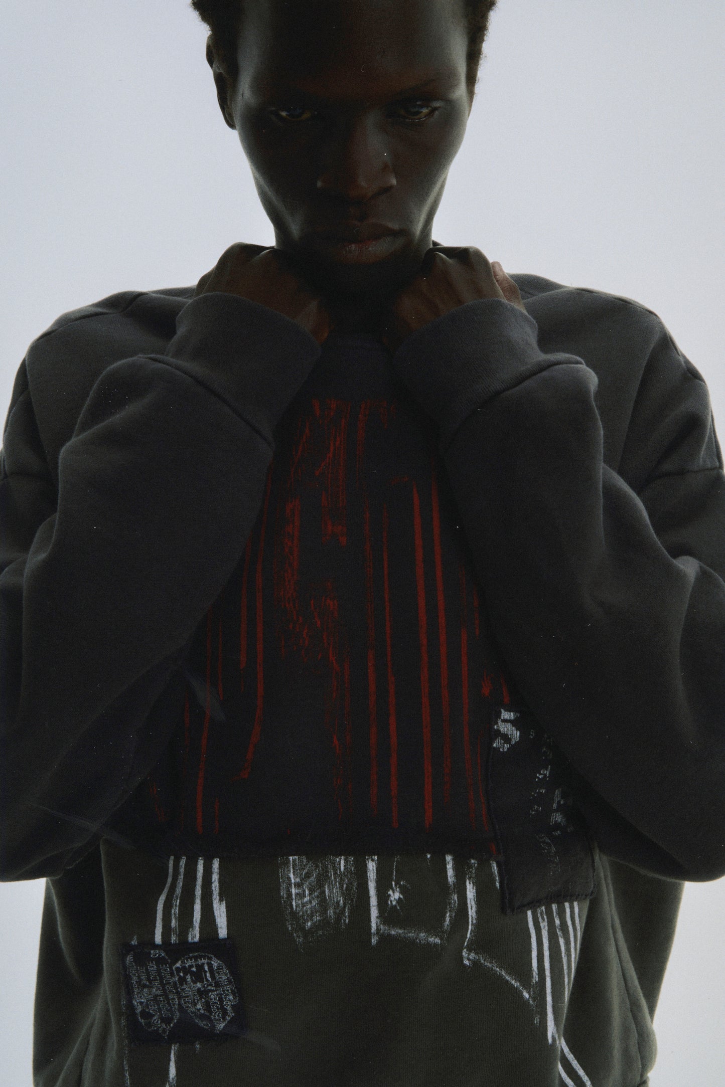 BLACK DIFFUSED COLLEGIATE CREWNECK ON MODEL