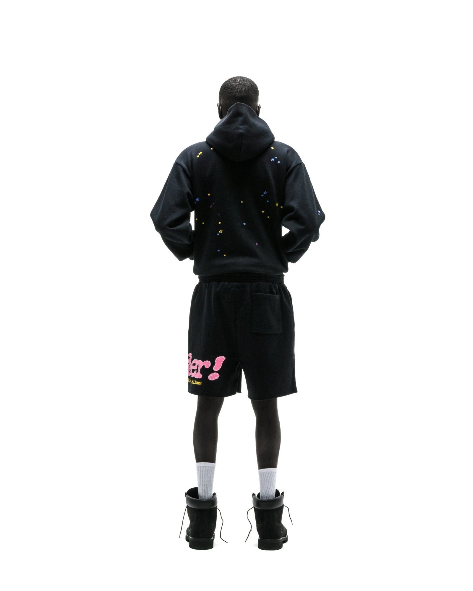 Black PUNK V2 zip-up hoodie with scattered colorful stars, paired with black shorts.