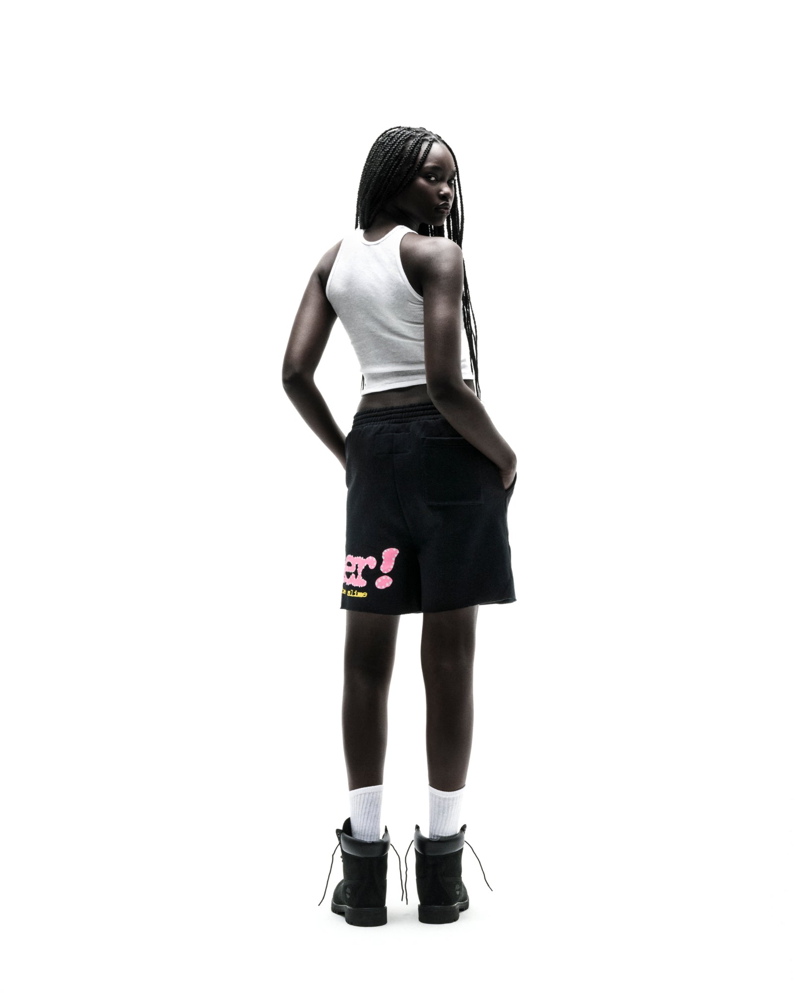 Black PUNK V2 SWEATSHORT with pink P*NK SP5DER text and scattered stars, worn by a model.