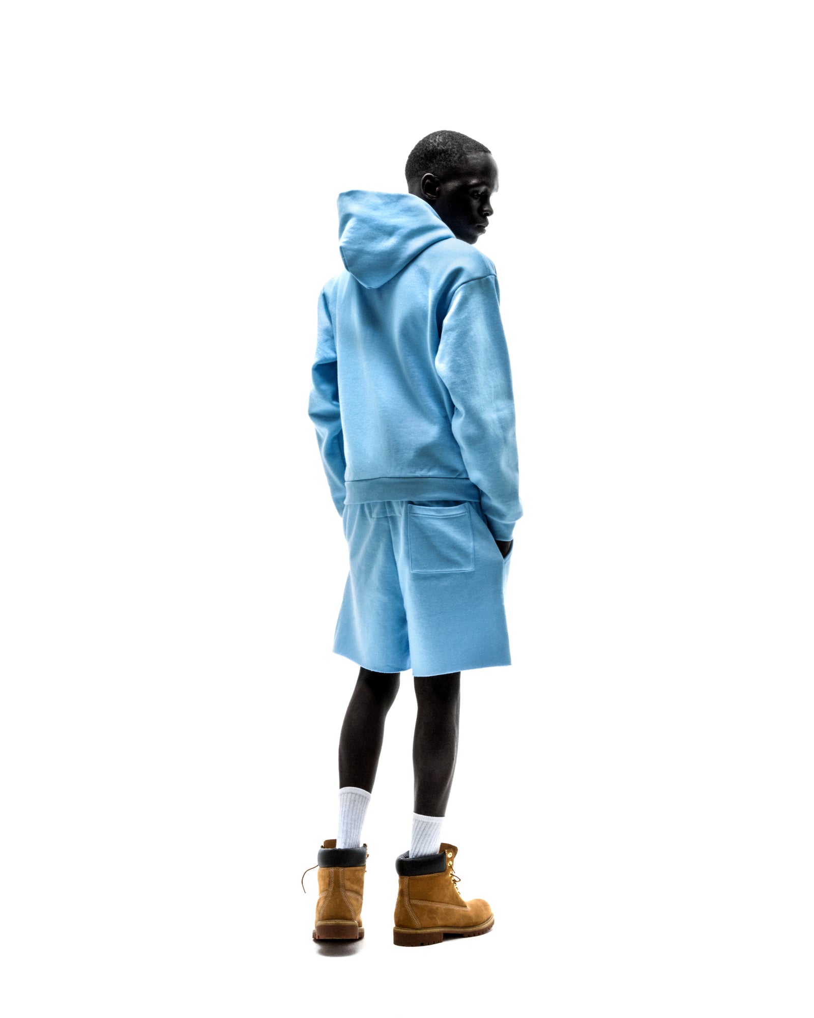 Model wearing light blue 13oz cotton fleece OG WEB ZIP UP hoodie and matching shorts.
