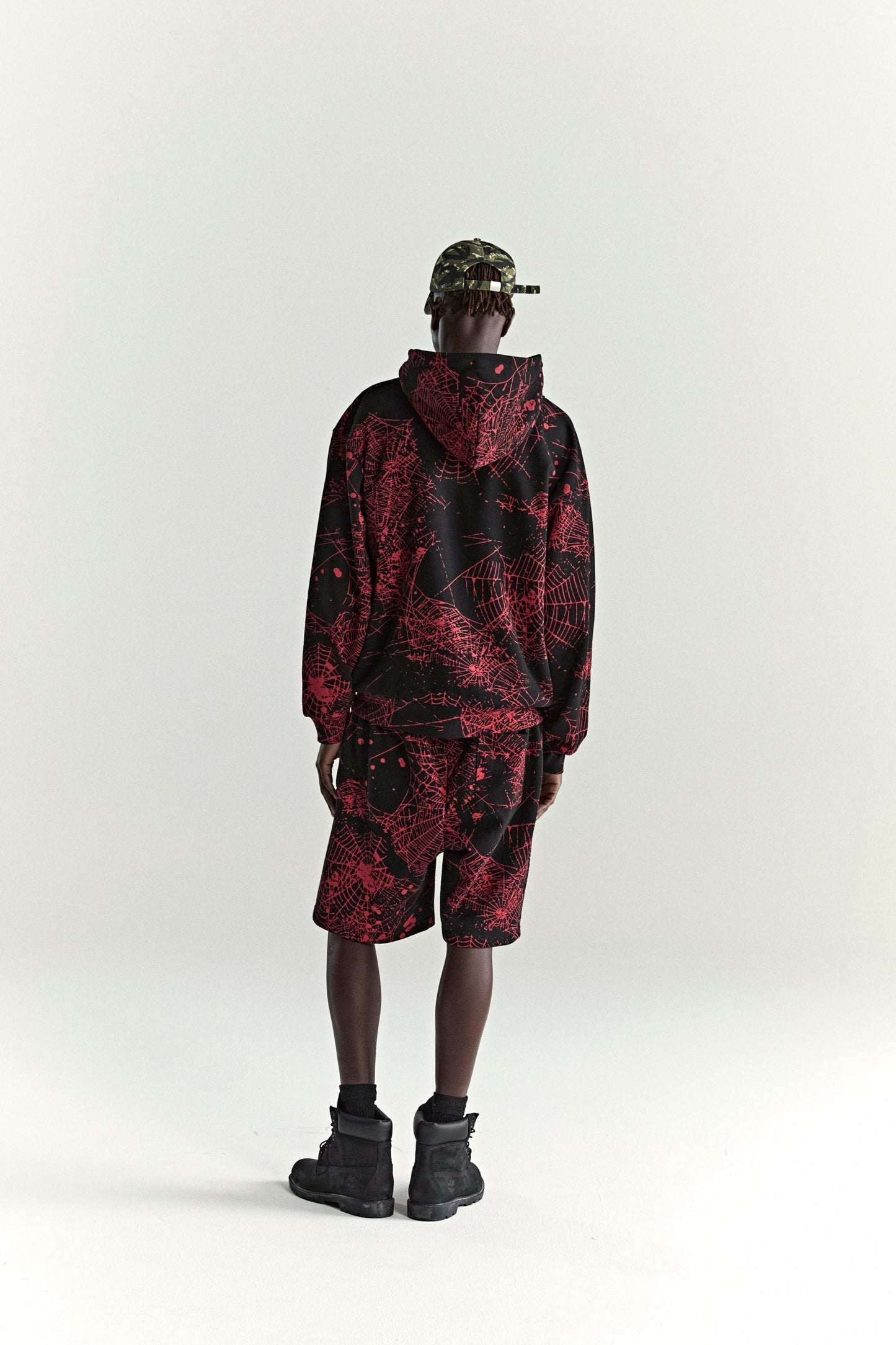 BLACK AOP WEB ZIP UP V2 HOODIE ON MODEL