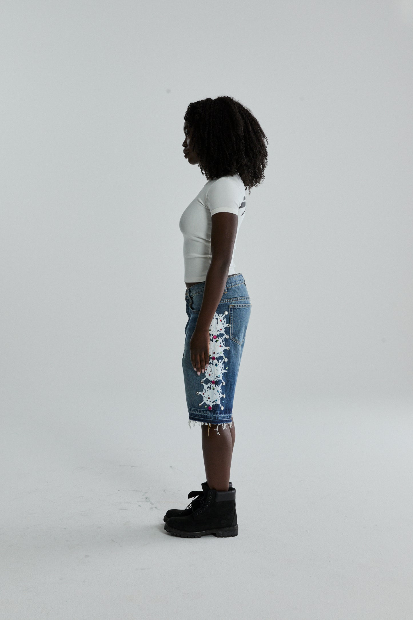 WHITE TM BABY TEE ON MODEL