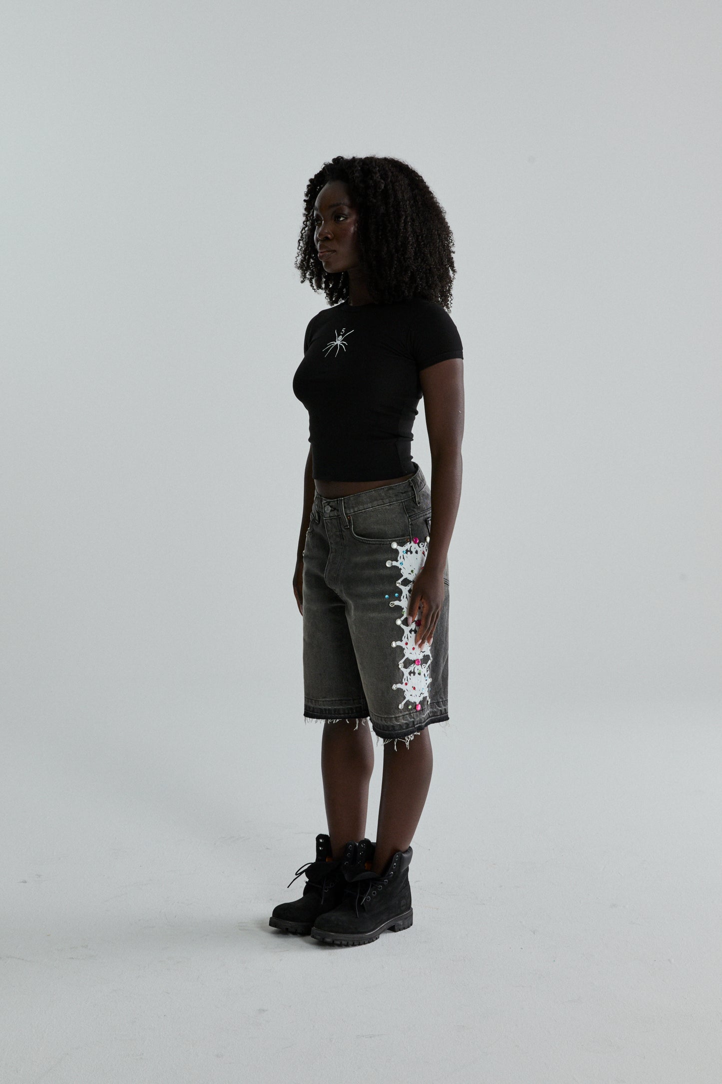 BLACK TM BABY TEE ON MODEL