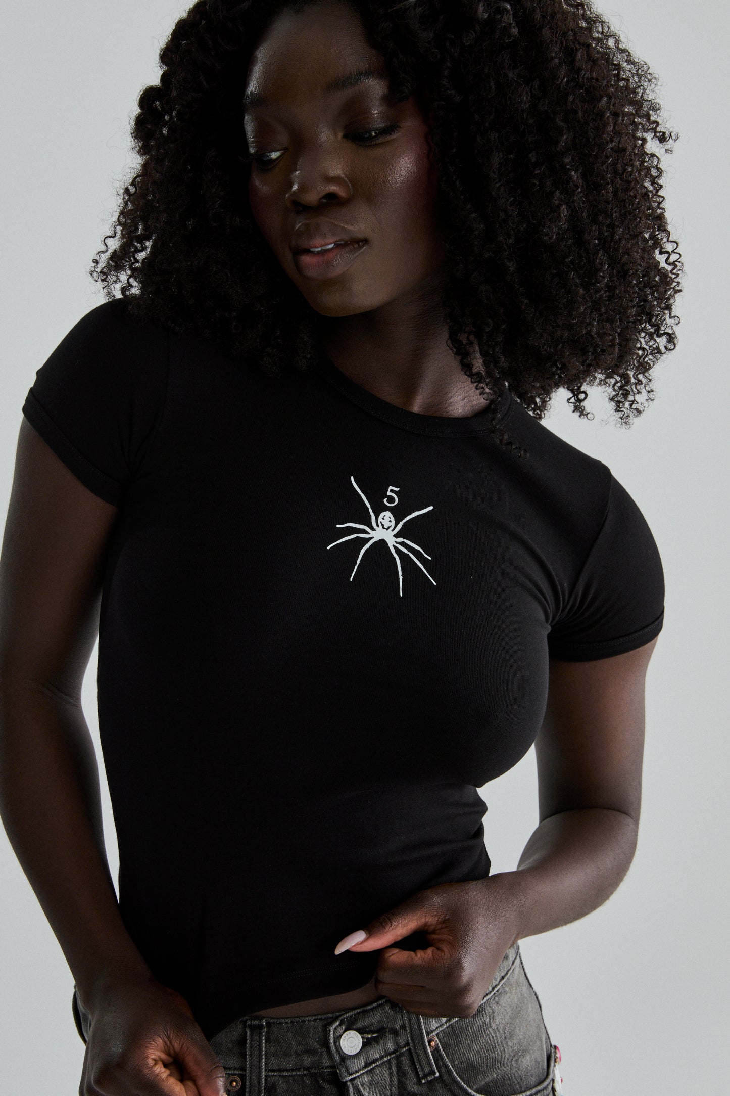 BLACK TM BABY TEE ON MODEL