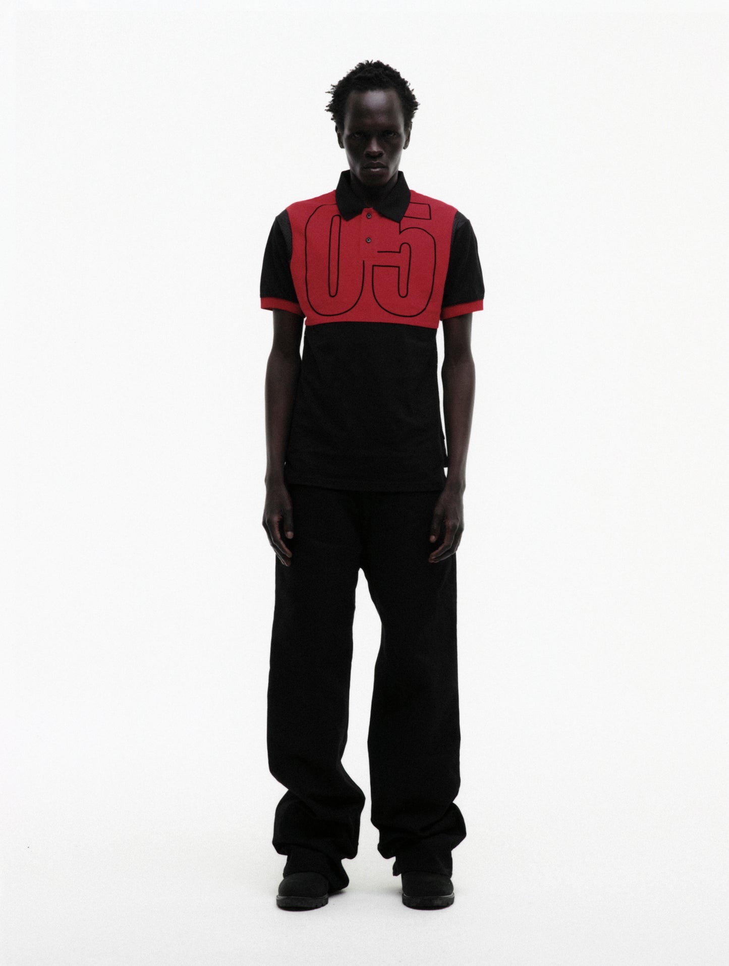 BLACK RECRUIT SS POLO ON MODEL