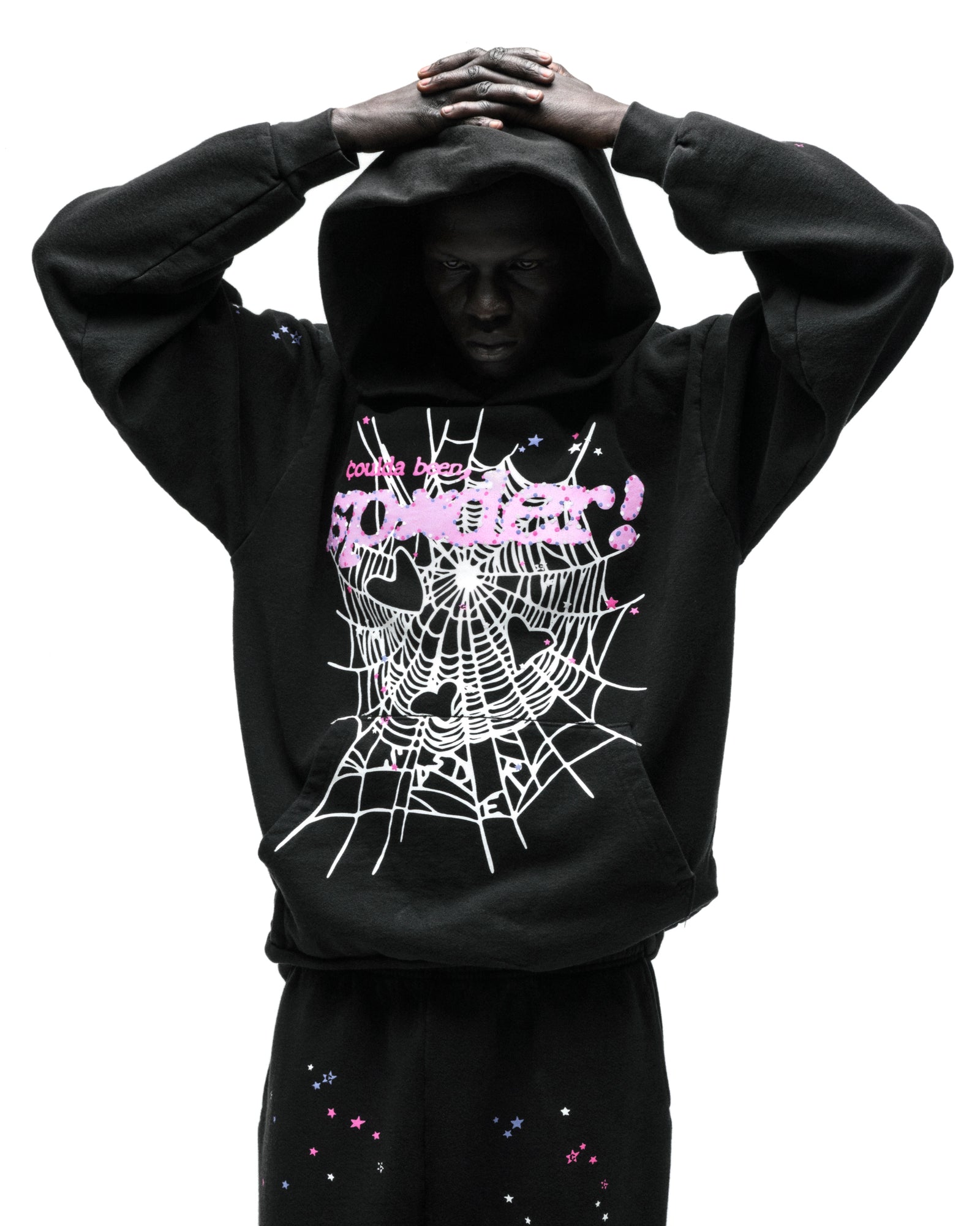 Black CB PUNK V2 Hoodie with pink SP5DER motif, white spider web, and scattered tiny stars.