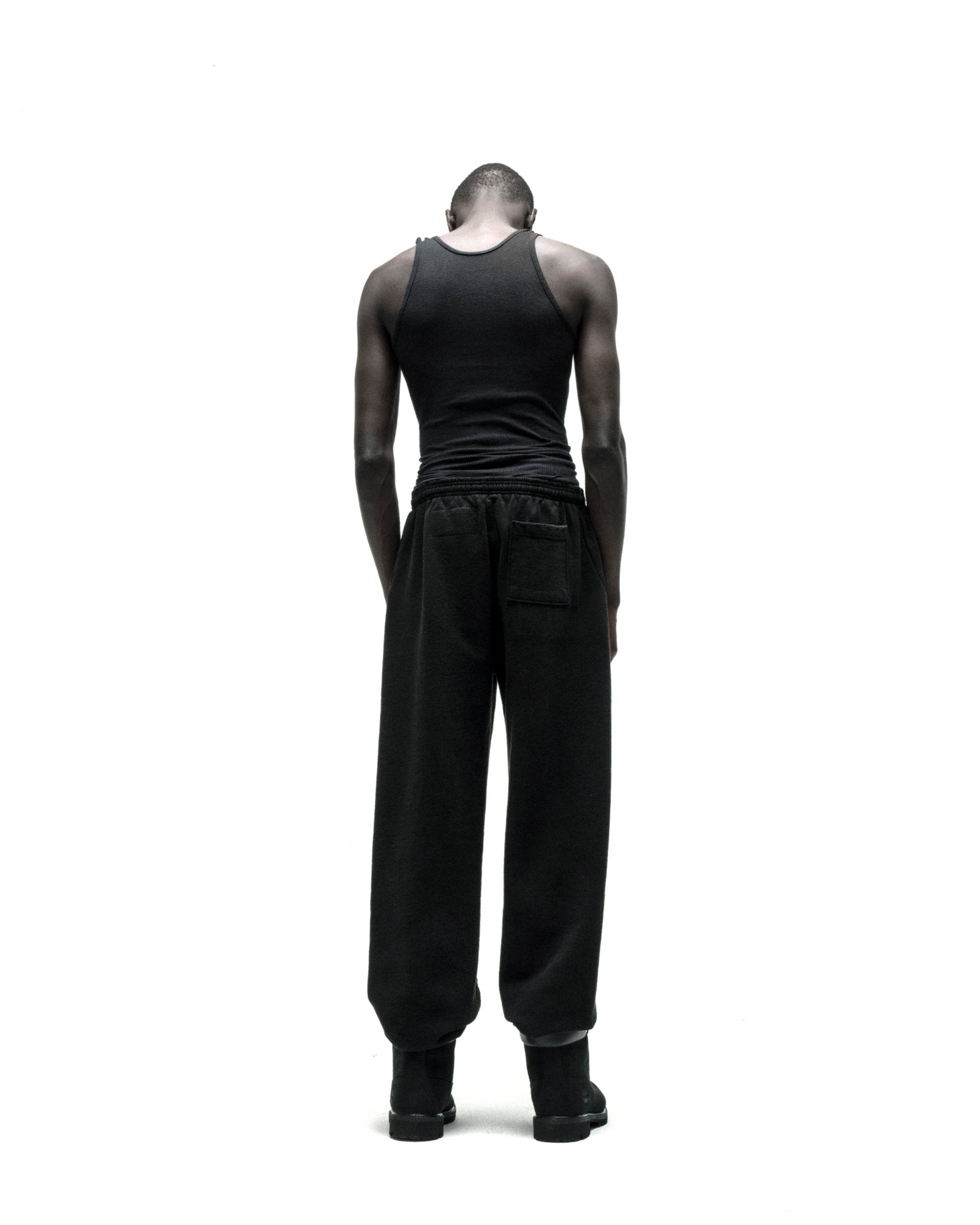 Black CB PUNK V2 Sweatpants with elasticized waistband and cuffs, shown on a model from behind.