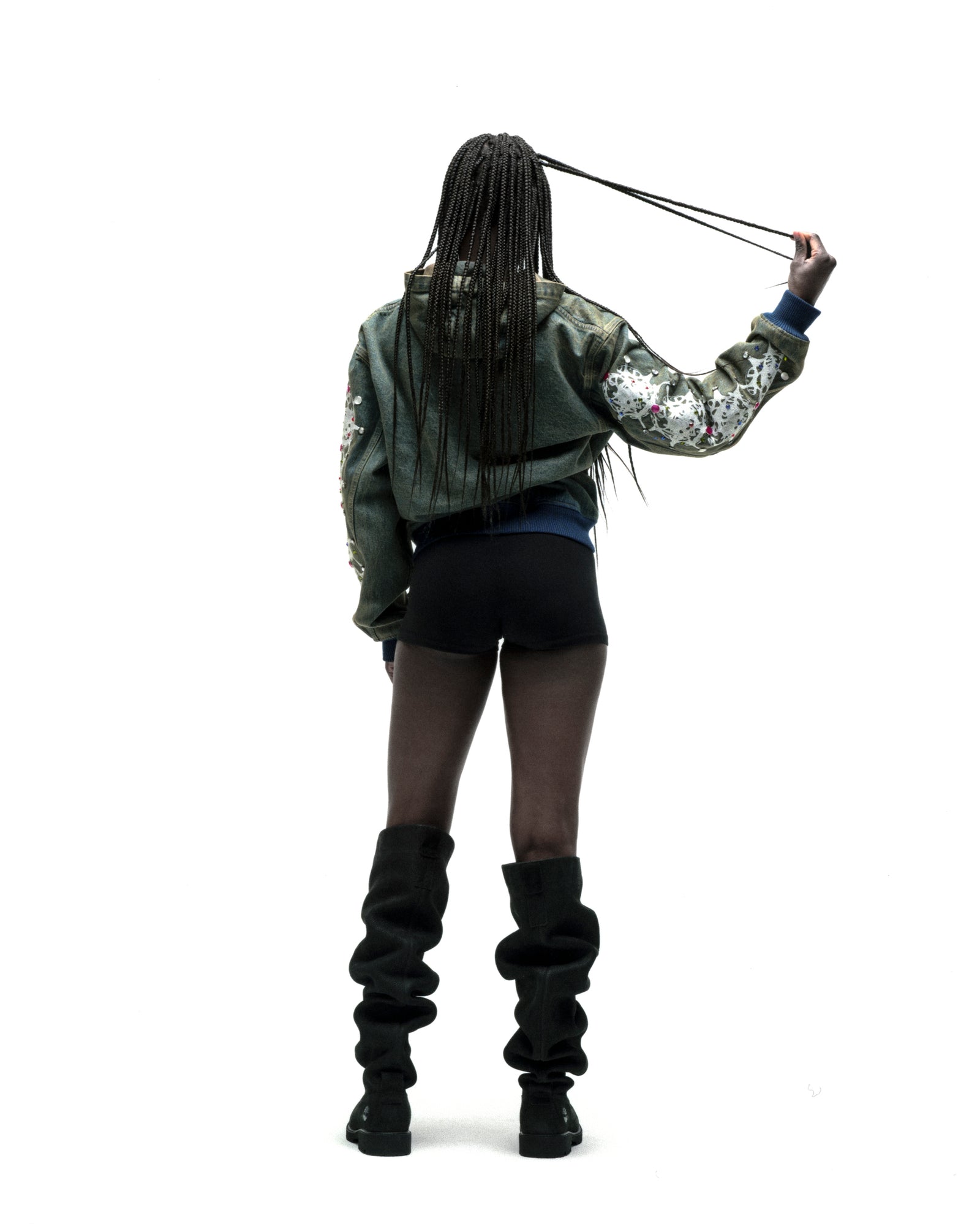 Faded denim jacket with web print and rhinestones on sleeves, rib-knit hem/cuffs.
