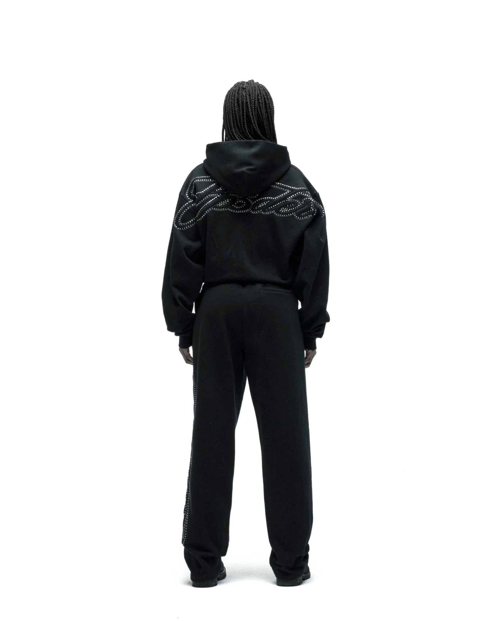 Black cotton fleece zip hoodie with rhinestone script on back, paired with matching sweatpants.