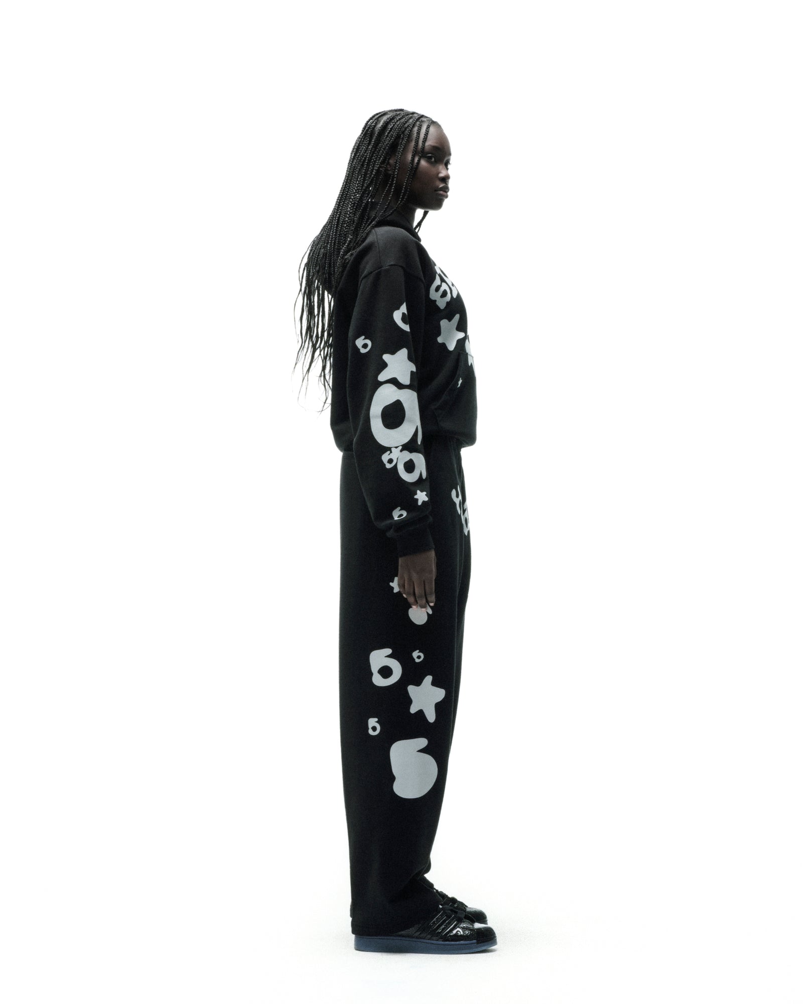 Black cotton fleece sweatpant with reflective white '5' and star designs.