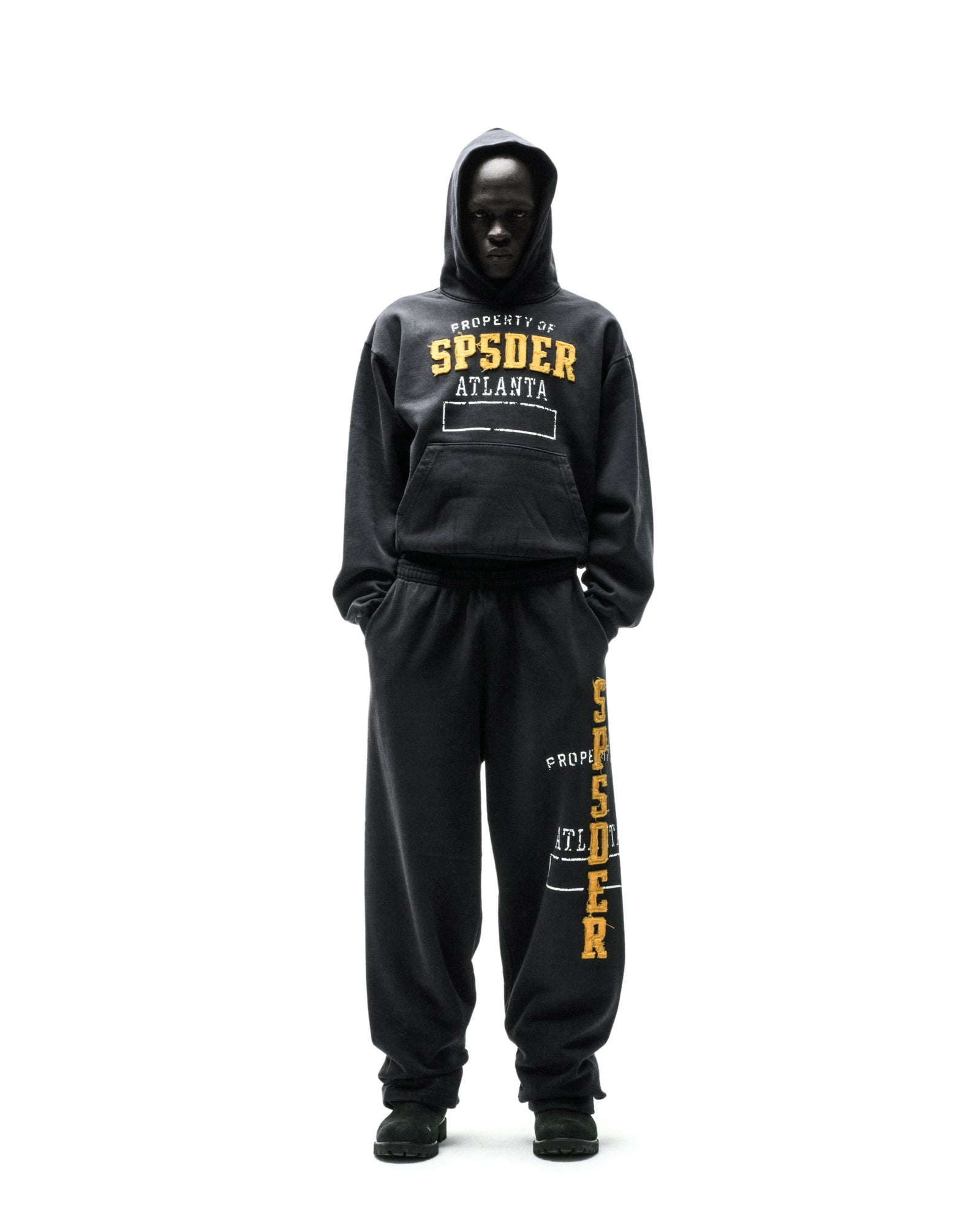 Black ISSUE 404 hoodie and sweatpants with yellow "SPSDER ATLANTA" chenille-style lettering.