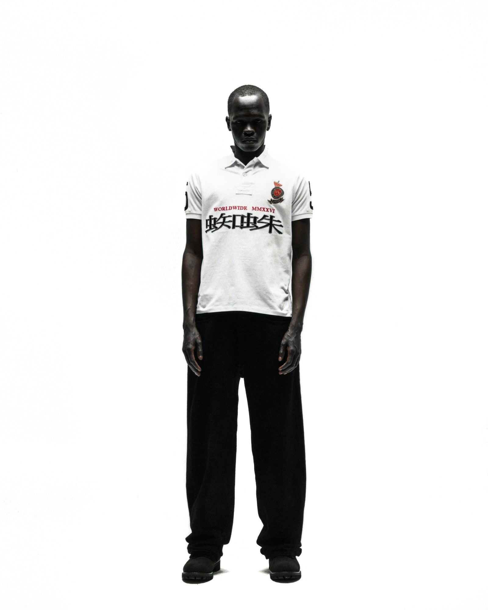 WORLDWIDE POLO white short-sleeve polo shirt with red rose crest and black text.