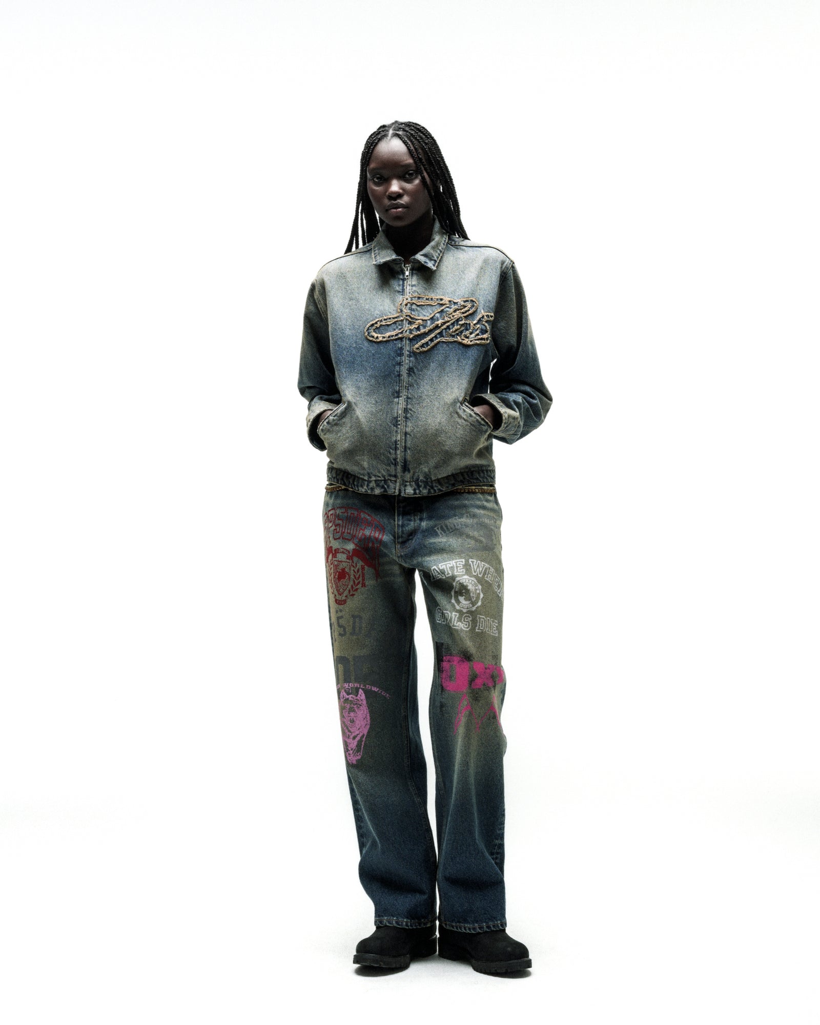 Washed blue denim work jacket with script logo, paired with graphic-print jeans.