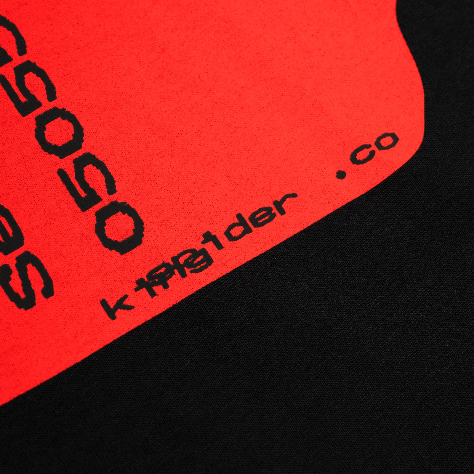 Black cotton tee with a vibrant red graphic print featuring "SP5DER.co" text.