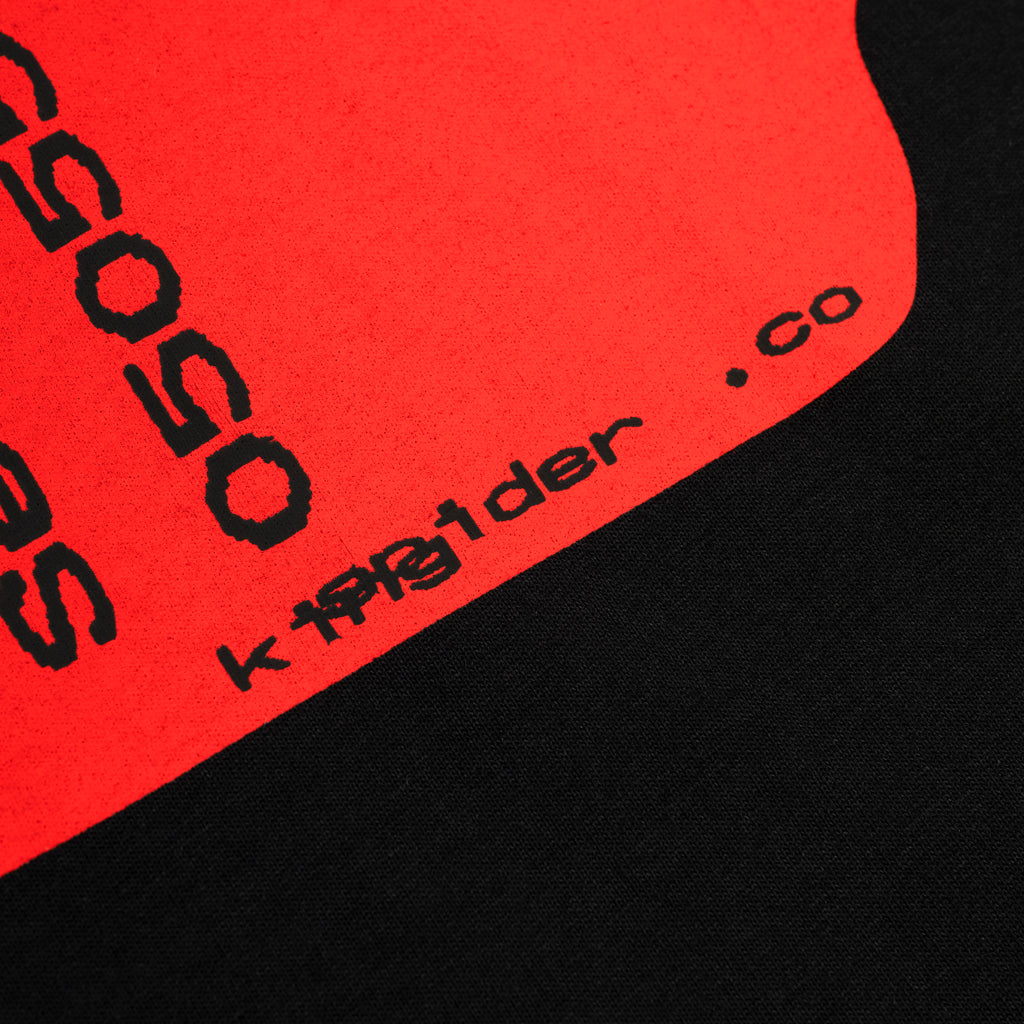 Black cotton tee with a vibrant red graphic print featuring "SP5DER.co" text.