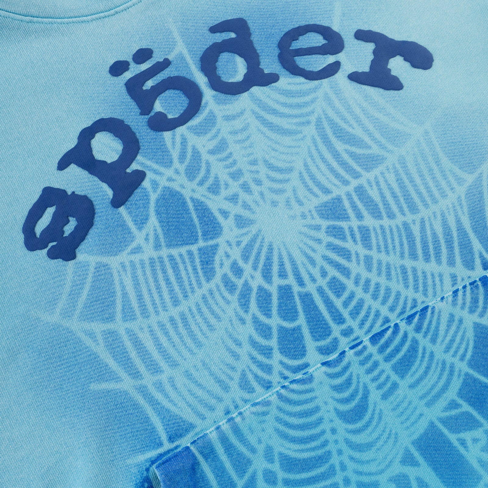 Blue cotton fleece hoodie with "Sp5der" puff print and white spray web design.