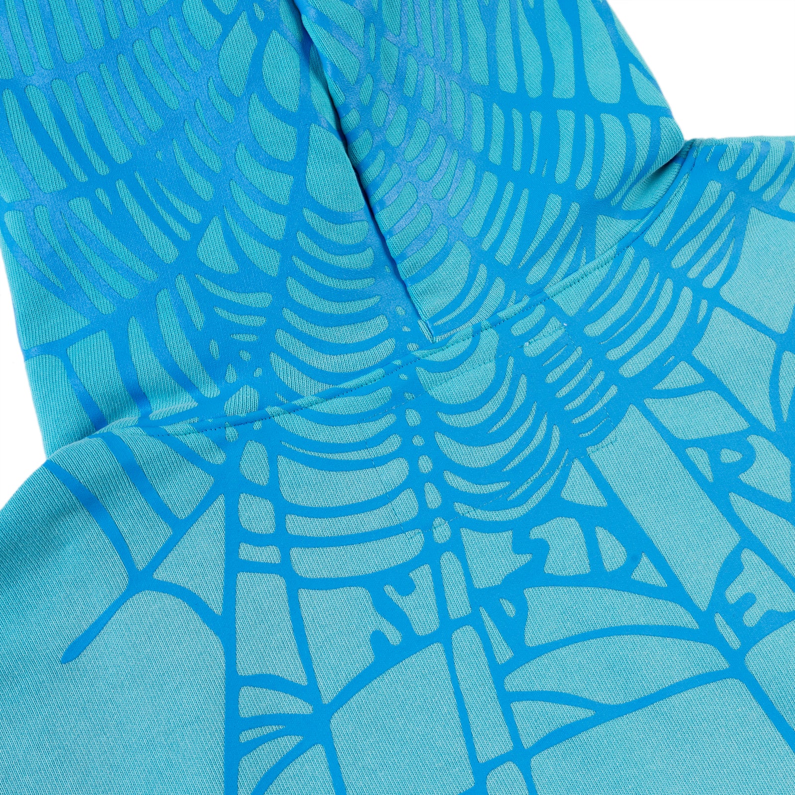 Heavy Web Hoodie in blue 13oz cotton fleece with a spider web print on the back hood and shoulders.
