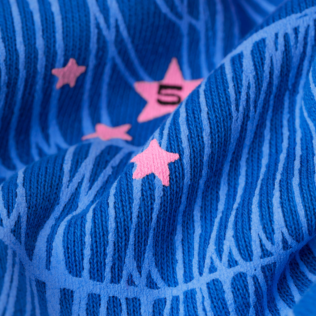 Blue fleece hoodie with pink puff print "555" angel numbers, scattered stars, and web print.