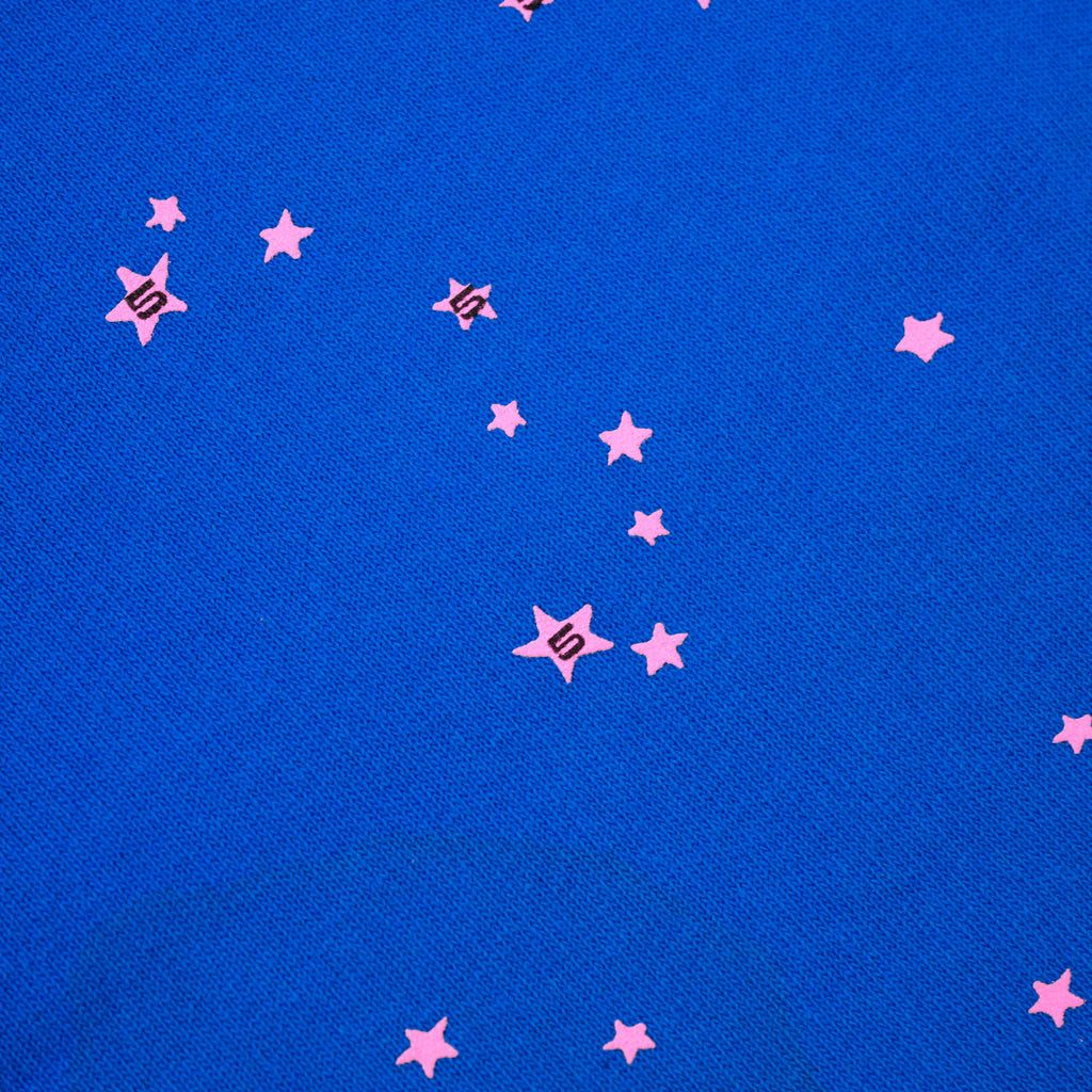Blue cotton fleece sweatpant with scattered pink star print.