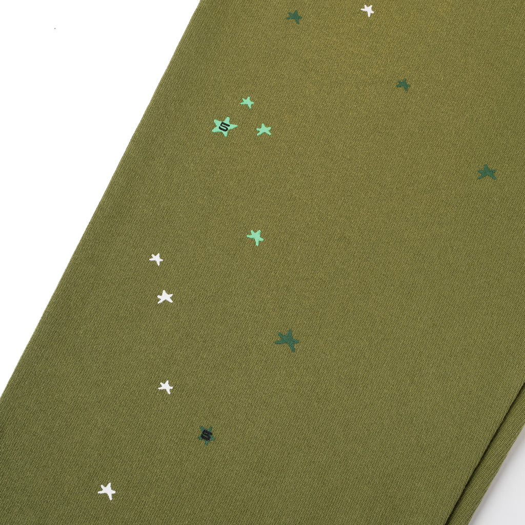 Olive green HEAVY WEB SWEATPANT with scattered white and green star print, SP5DER web graphic.