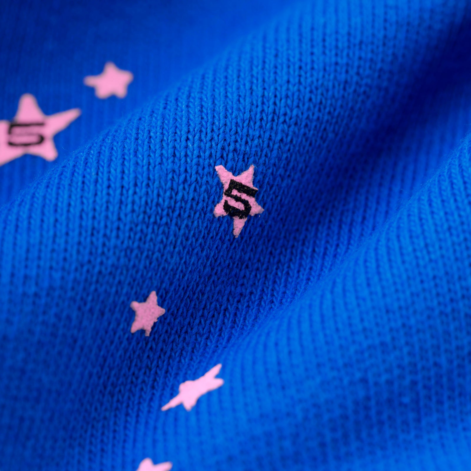 Blue cotton fleece sweatpant with pink puff print stars and '5' angel numbers.