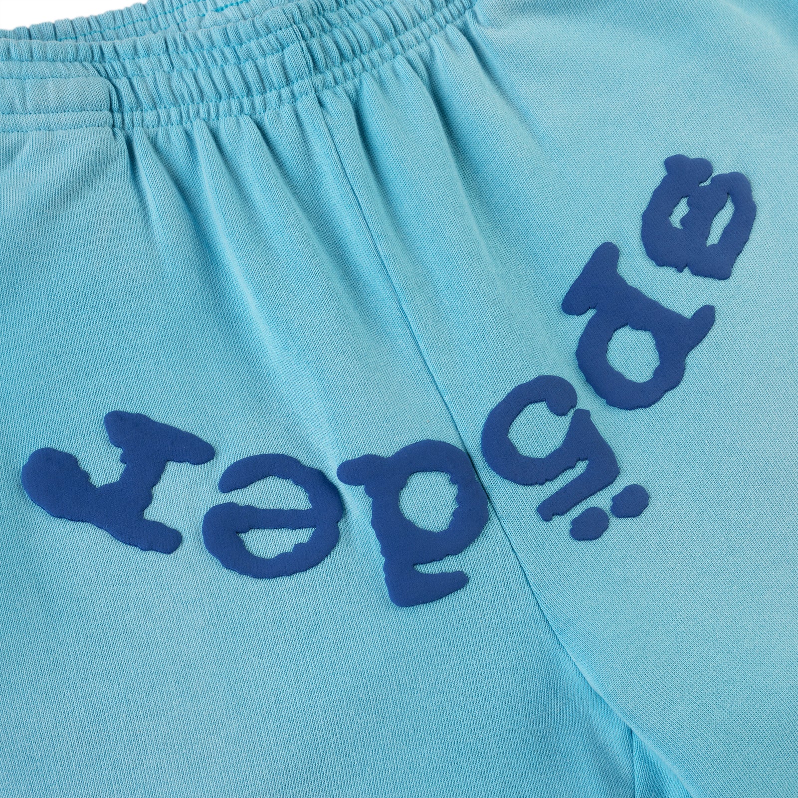 Light blue cotton fleece sweatpant with dark blue puff print "SP5DER" text.