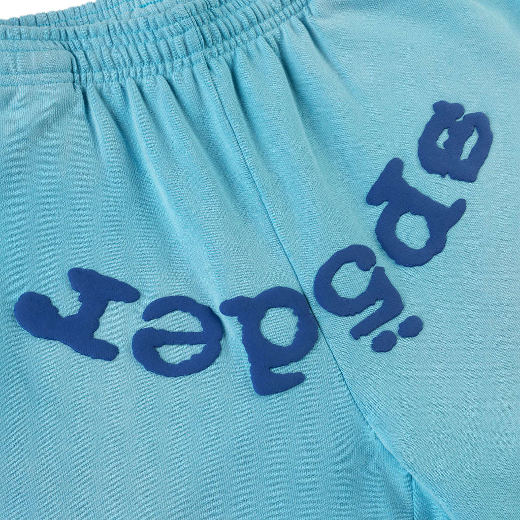 Light blue cotton fleece sweatpant with dark blue puff print "SP5DER" text.