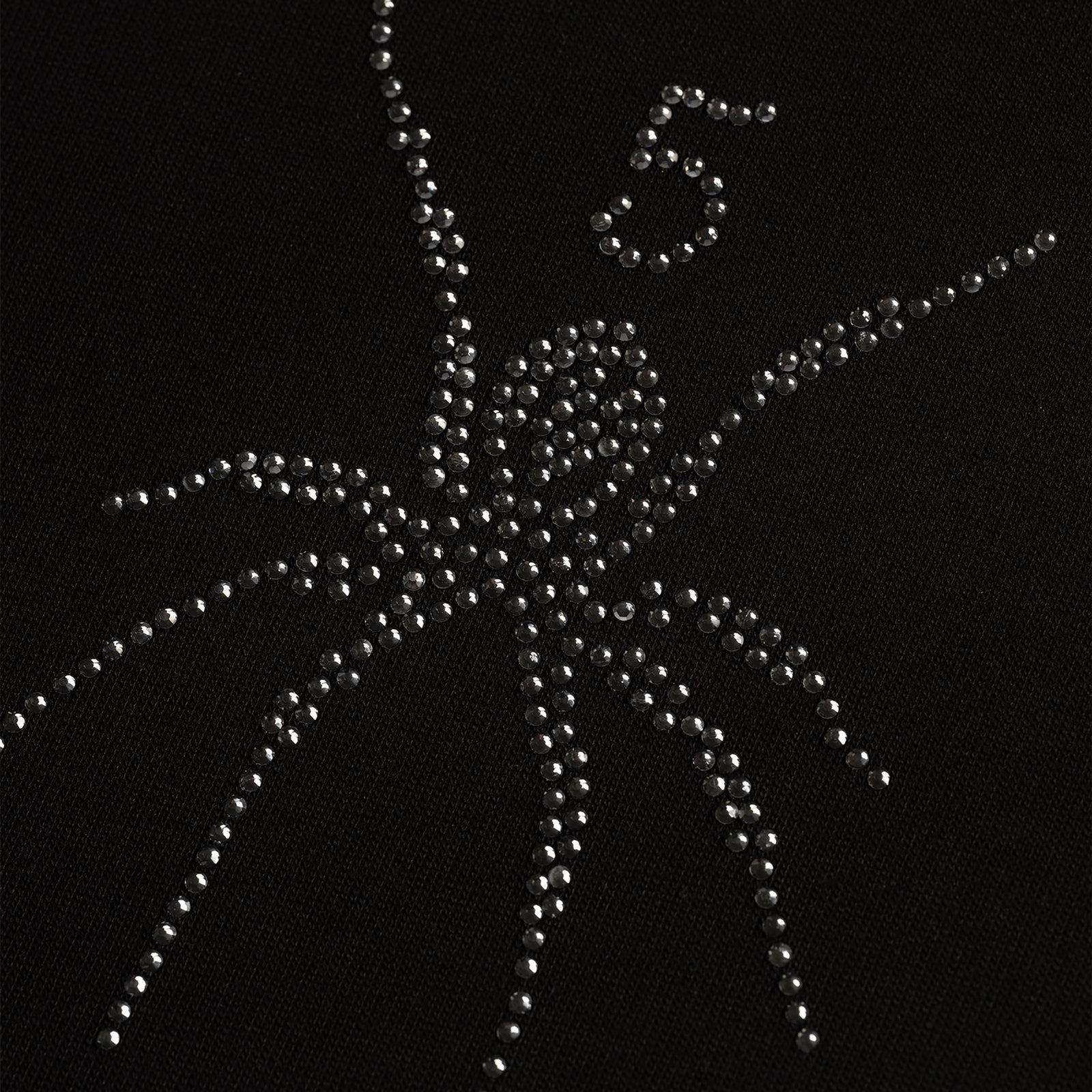 Black cotton tee with a rhinestone spider graphic and the number 5.