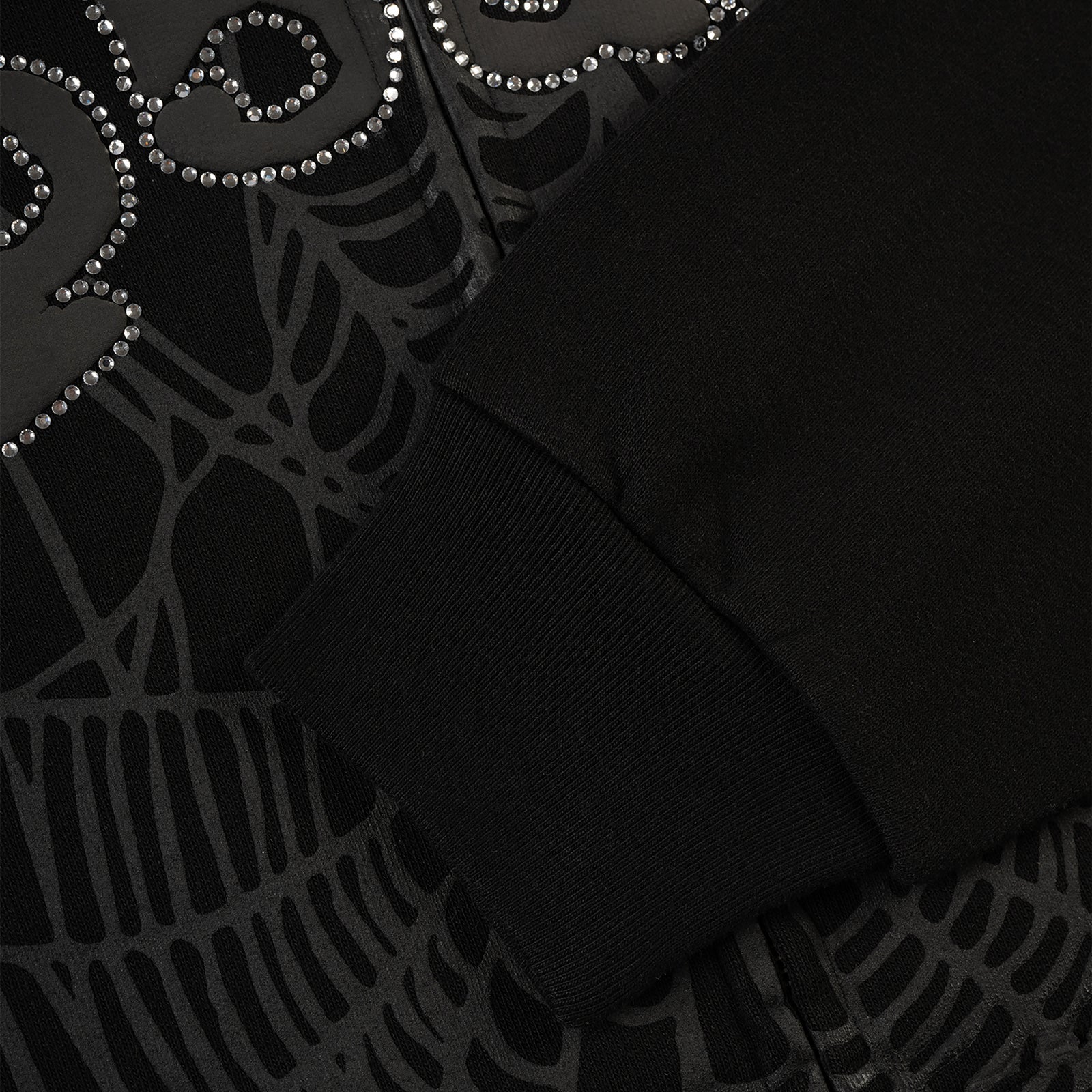 Black OG WEB V2 Rhinestone Zip Up hoodie with spiderweb design and ribbed cuff.