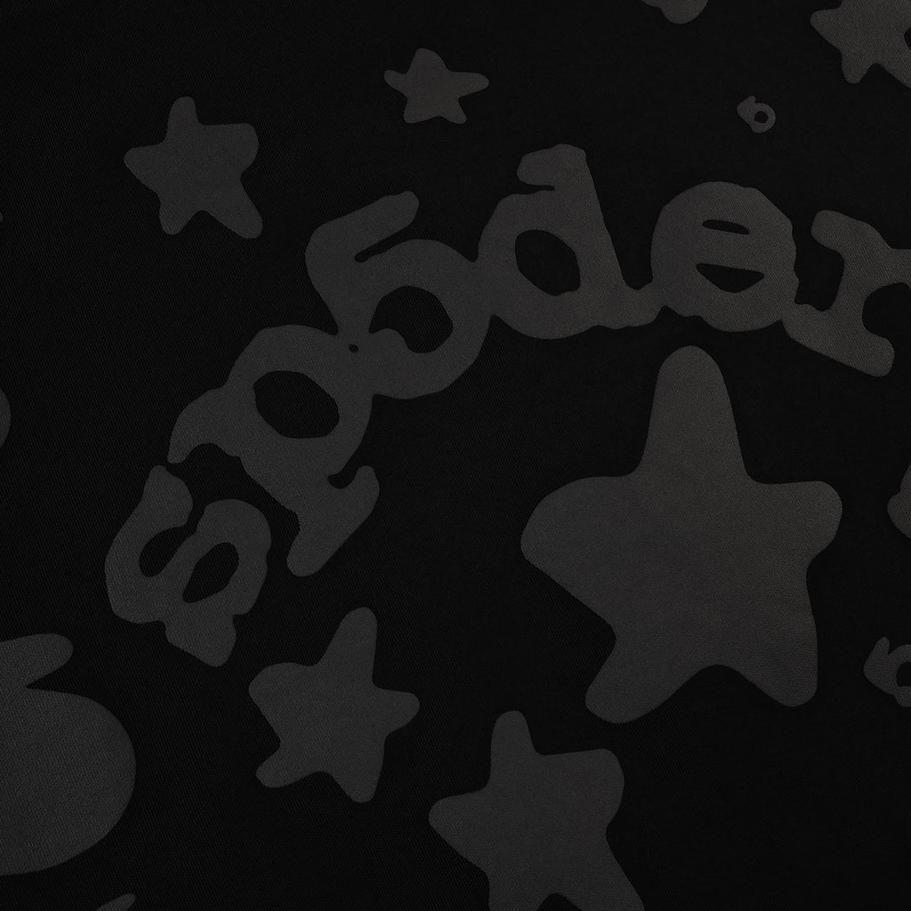 Close-up of the black Phantom Beluga Tote fabric with subtle dark gray star and "sp5der" logo pattern.