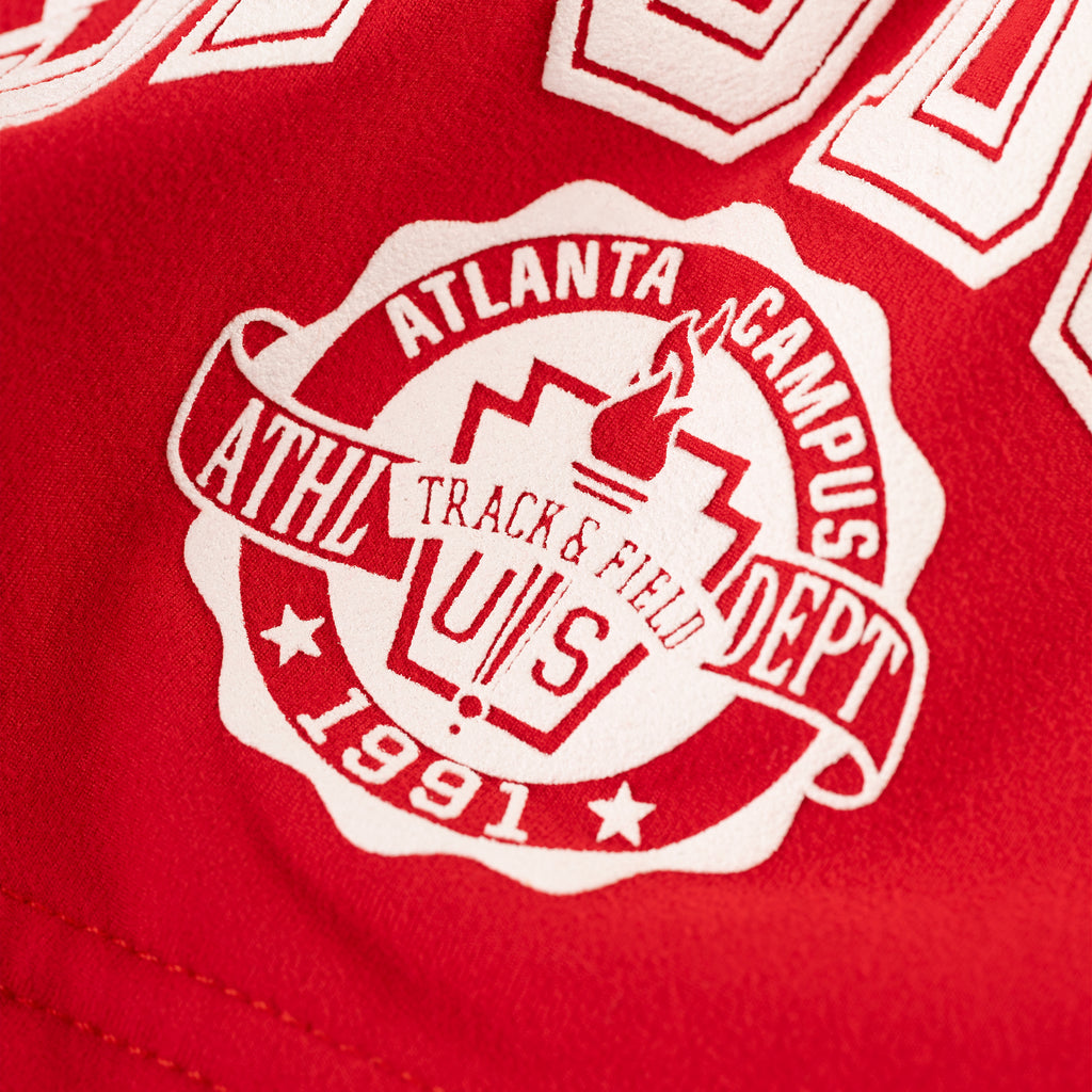 Red stretch cotton jersey short with white SP5DER collegiate graphic.