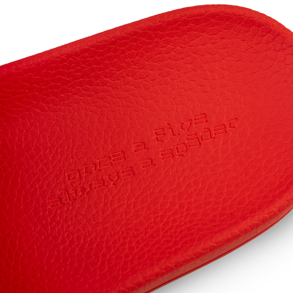Red ENZO SLIDE 001 with "once a five always a spider" embossed on the molded rubber footbed.