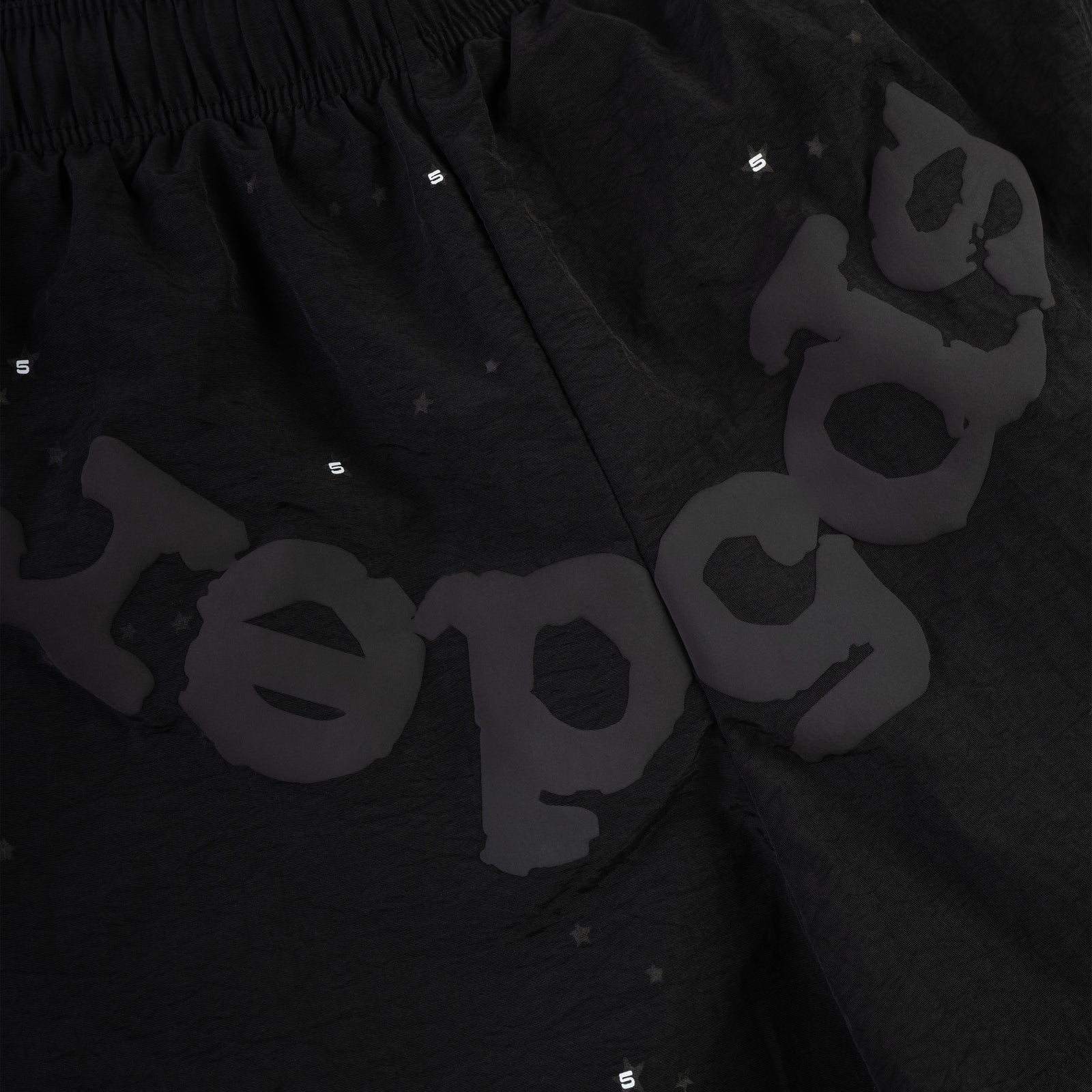 Black OG WEB Double Layer Short with subtle star print and "sp5der" text.