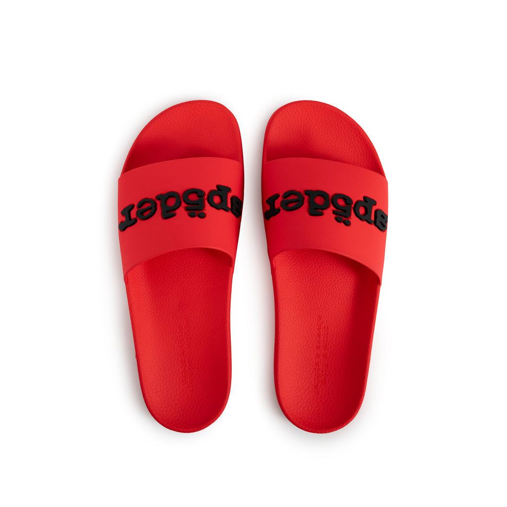 Red rubber ENZO SLIDE 001 with black logo bonded at vamp, molded footbed, and web-design sole.