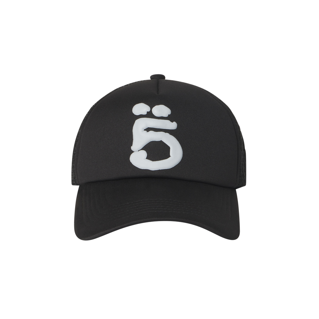 Black trucker hat featuring a white puff print graphic logo, curved brim, and breathable mesh side panels.