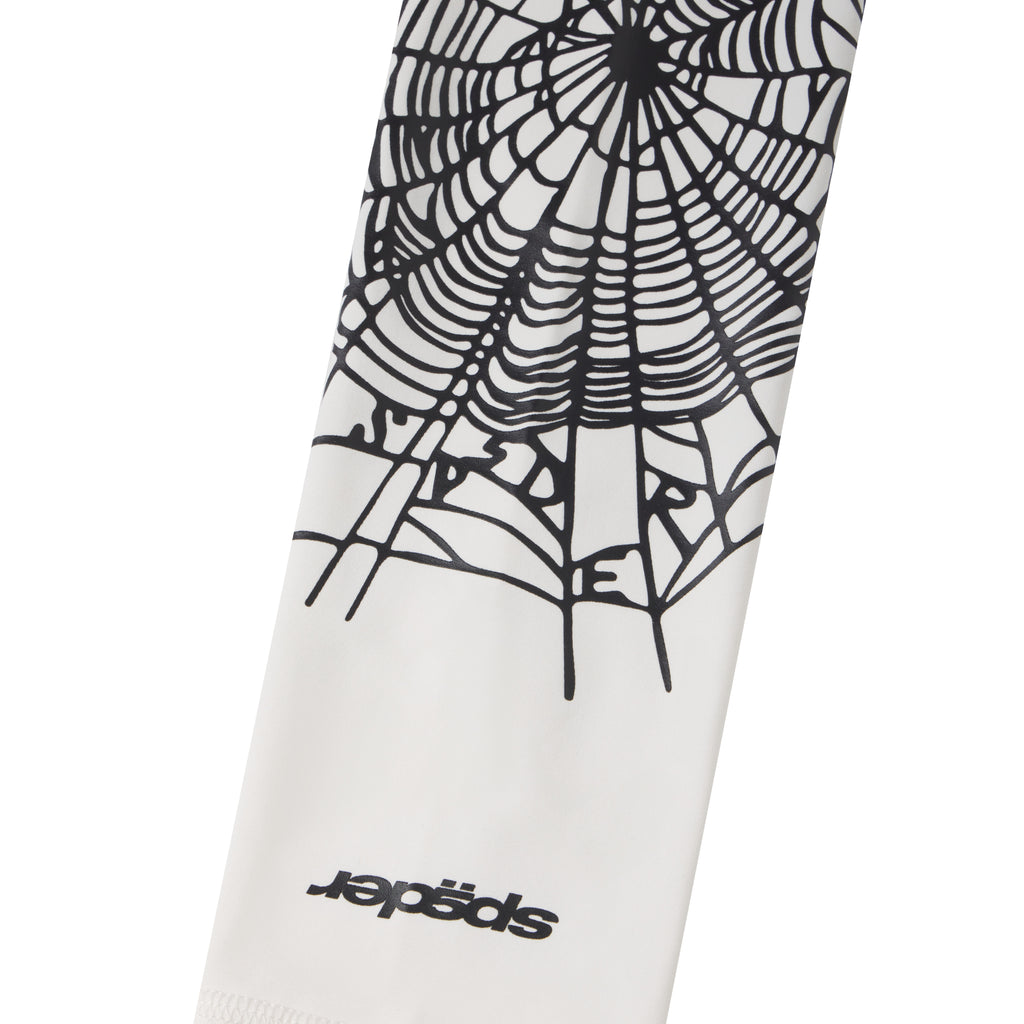 White compression arm sleeve featuring a black spider web graphic print and a signature logo detail.