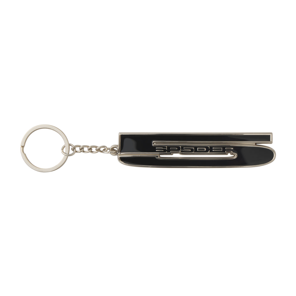 Silver-tone metal keychain featuring a black enameled SP5DER graphic design charm attached to a circular keyring.