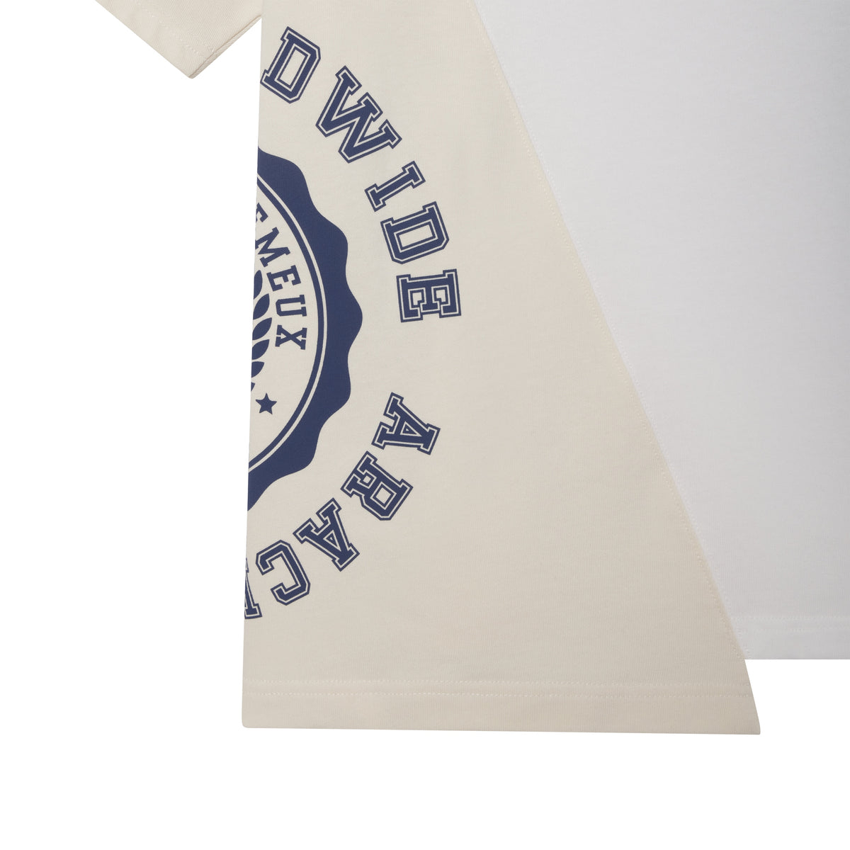 Asymmetrical cotton tee featuring color-block panels in white and beige with a collegiate-style navy graphic print.