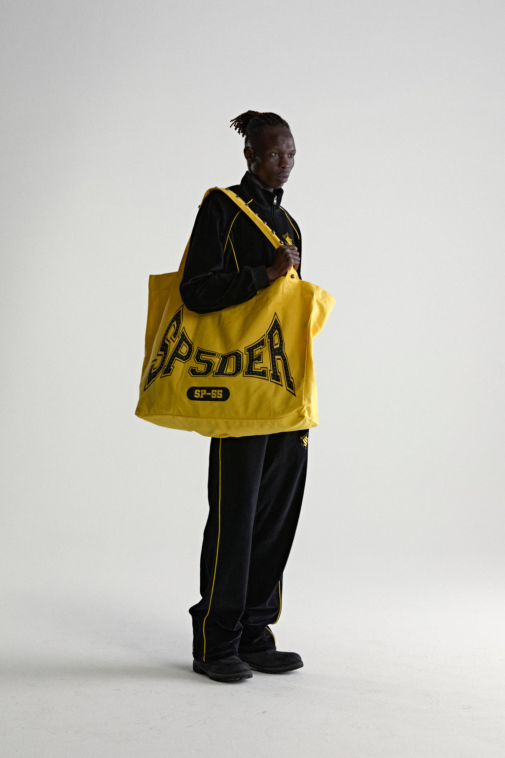 YELLOW T&F STUDDED TOTE ON MODEL