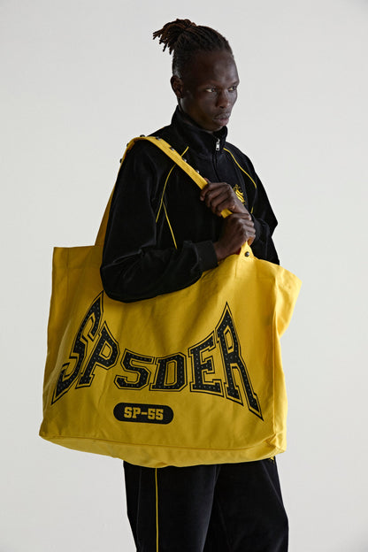 YELLOW T&F STUDDED TOTE ON MODEL