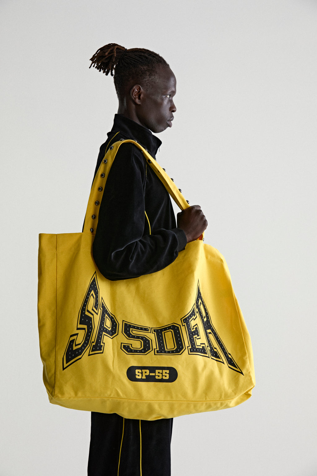 YELLOW T&F STUDDED TOTE ON MODEL