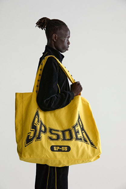 YELLOW T&F STUDDED TOTE ON MODEL