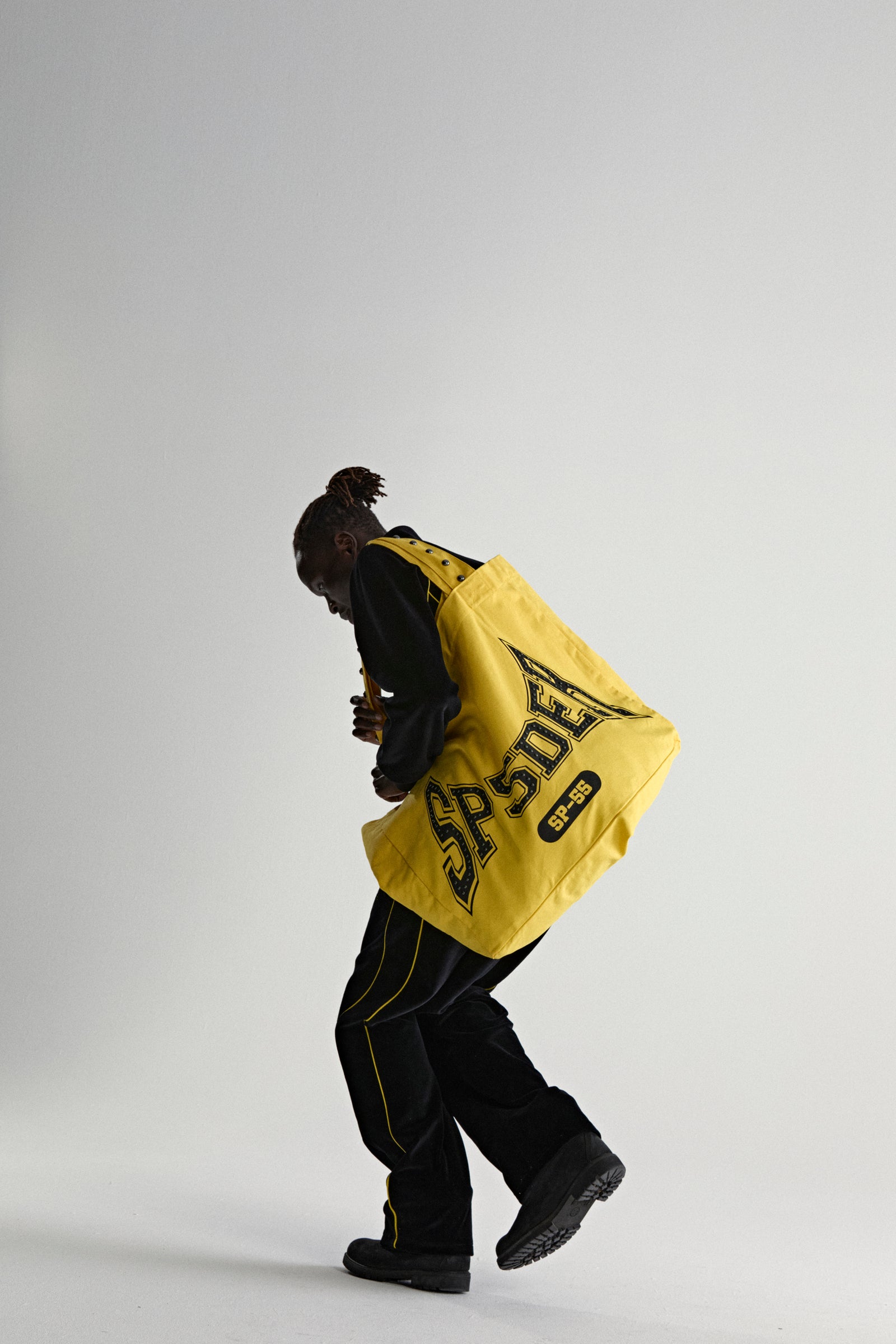 YELLOW T&F STUDDED TOTE ON MODEL