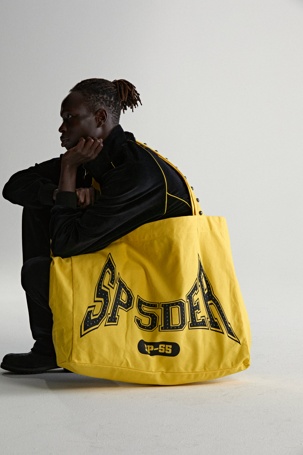 YELLOW T&F STUDDED TOTE ON MODEL