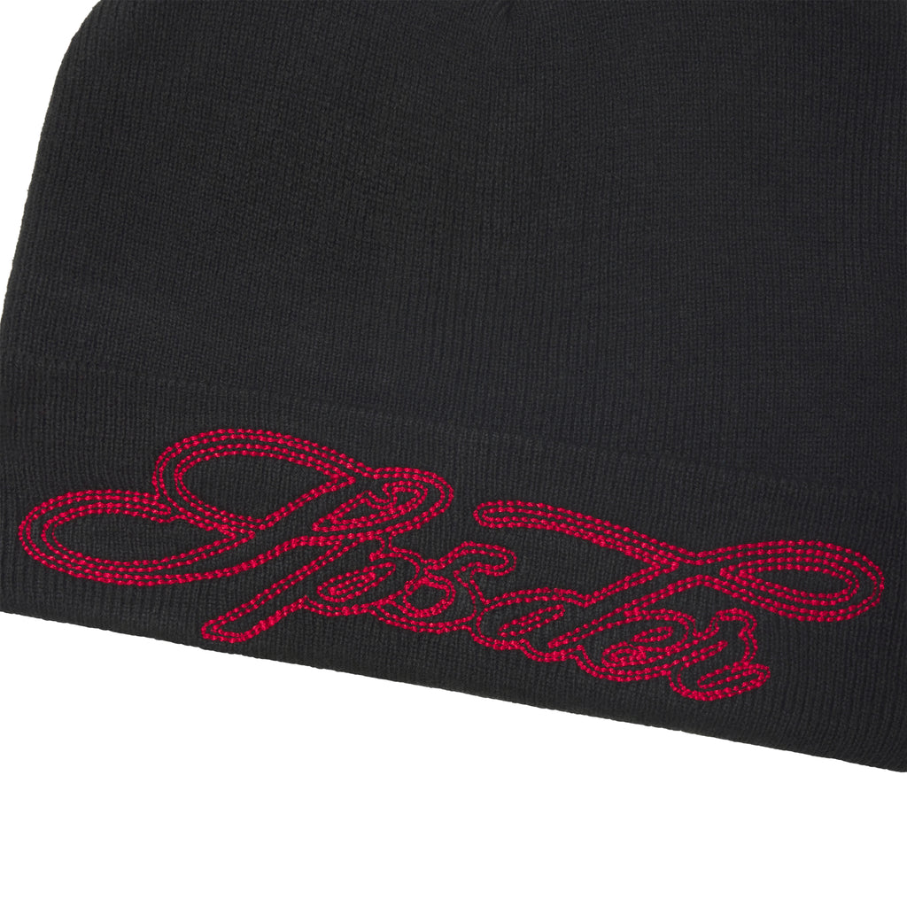 Black rib knit cuffed beanie featuring red contrast script embroidery graphic design on the fold-over cuff.