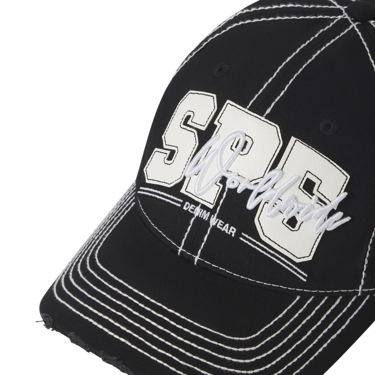 Black denim baseball cap with white contrast stitching, layered SP5 logo appliqué, script embroidery, and a distressed curved brim.