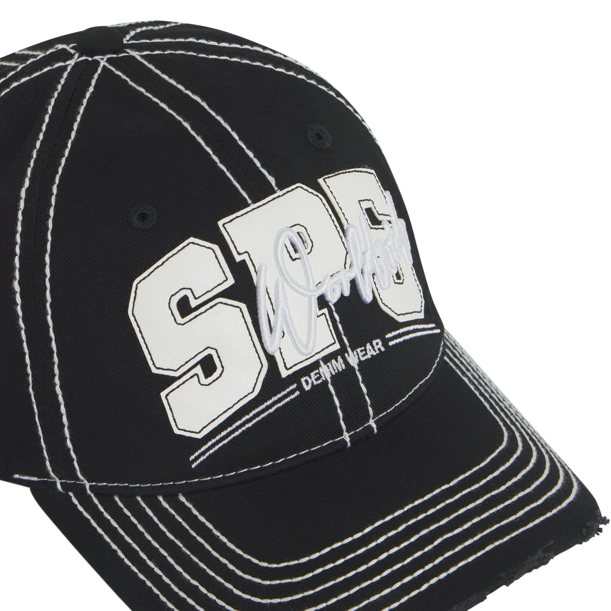 Black denim baseball cap with white contrast stitching, layered SP5 logo appliqué, script embroidery, and distressed brim.