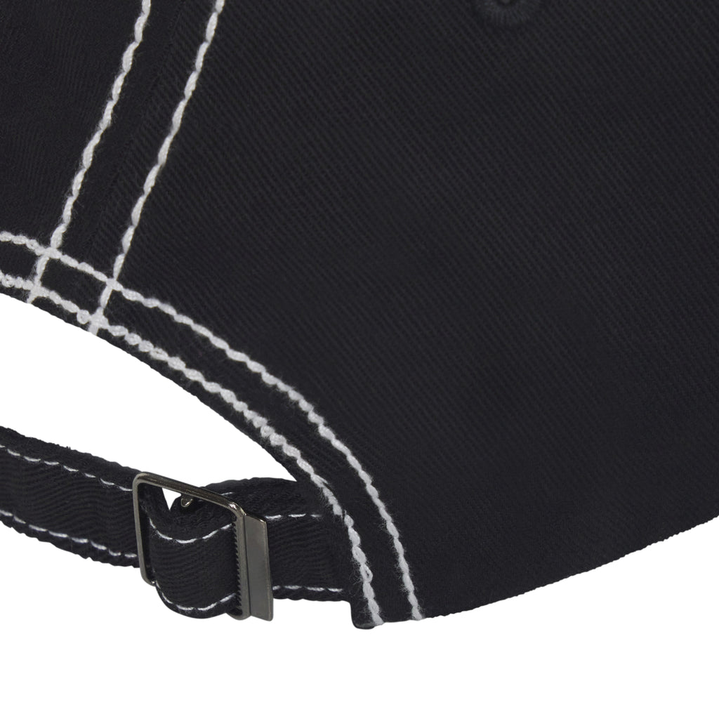 Black denim baseball cap featuring white contrast stitching and an adjustable back strap with a metal buckle.